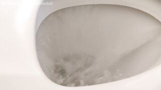 Sitting backwards on the Toilet Peeing