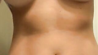 Playing with my nipples and squeezing my perky tits