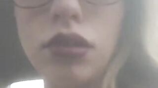 Beautiful  junkie doing a shot in the car