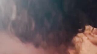 Curly headed Latina give BJ in car