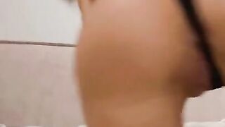 The brunette fucks her sweet ass with her fingers. Anal close-up.