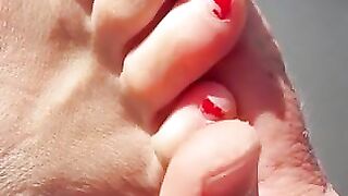 Sexy toes closeup in the sun