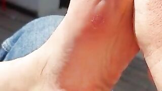 Sexy toes closeup in the sun