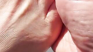 Sexy toes closeup in the sun
