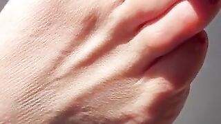 Sexy toes closeup in the sun