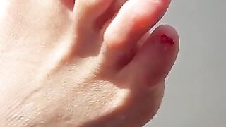 Sexy toes closeup in the sun