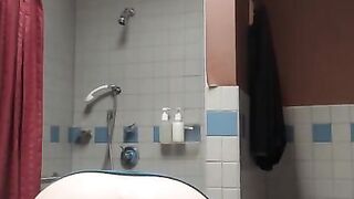 Slut spreads her holes in the bathroom