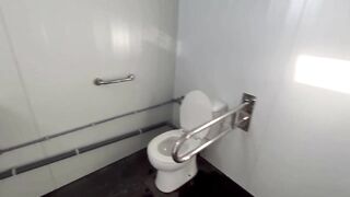 I surprise a girl who catches me jerking off in a public bathroom on the beach and helps me finish cumming
