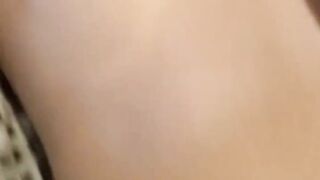Cumshot on an Asian pussy while she caresses her clit