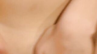 Cumshot on an Asian pussy while she caresses her clit