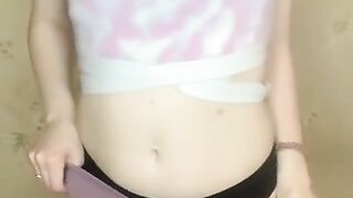 showing off her toned body