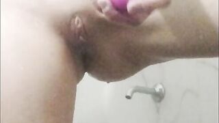 Sexy girl masturbates in bathroom while watching porn