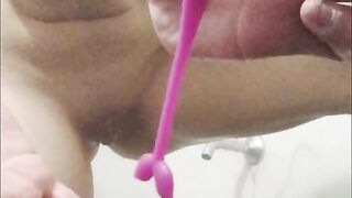Sexy girl masturbates in bathroom while watching porn