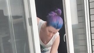 A neighbor girl washes windows without a bra and panties