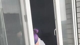 A neighbor girl washes windows without a bra and panties