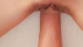 Fisting a teen's shaved pussy close up