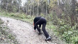 girl in high-heeled boots wants to go to home, but there is dirty slippery slide on the way