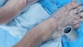 Letting fast water run across the top of my feet as I drain a pool