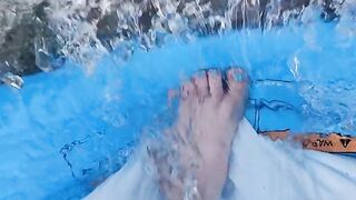 Letting fast water run across the top of my feet as I drain a pool