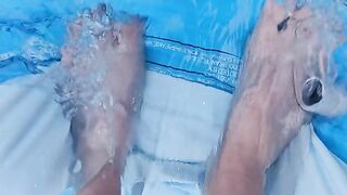 Letting fast water run across the top of my feet as I drain a pool