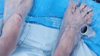 Letting fast water run across the top of my feet as I drain a pool