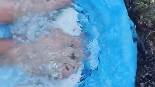 Letting fast water run across the top of my feet as I drain a pool
