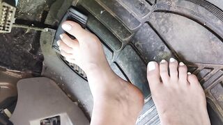 Pedal pumping barefooted in my big truck with white toe nails