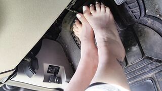 Pedal pumping barefooted in my big truck with white toe nails