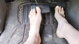 Pedal pumping barefooted in my big truck with white toe nails