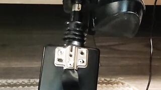 Giving a footjob in my strappy heels to a black cock on my fuck machine