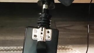 Giving a footjob in my strappy heels to a black cock on my fuck machine