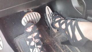 Big feet pedal pumping the gas pedal in strappy sexy black heels
