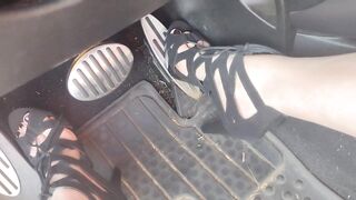 Big feet pedal pumping the gas pedal in strappy sexy black heels
