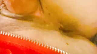 Red latex panties and a dildo