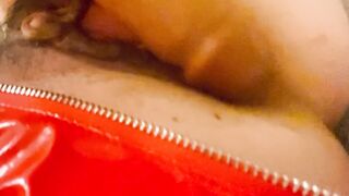 Red latex panties and a dildo