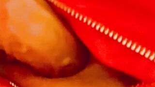 Red latex panties and a dildo