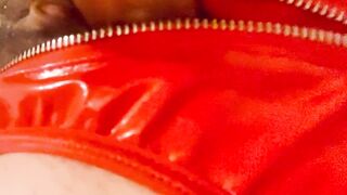 Red latex panties and a dildo