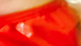 Red latex panties and a dildo