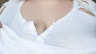 playing with my boobs by the window