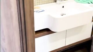 Juicy Julia peeing in bathroom and showing her big tits